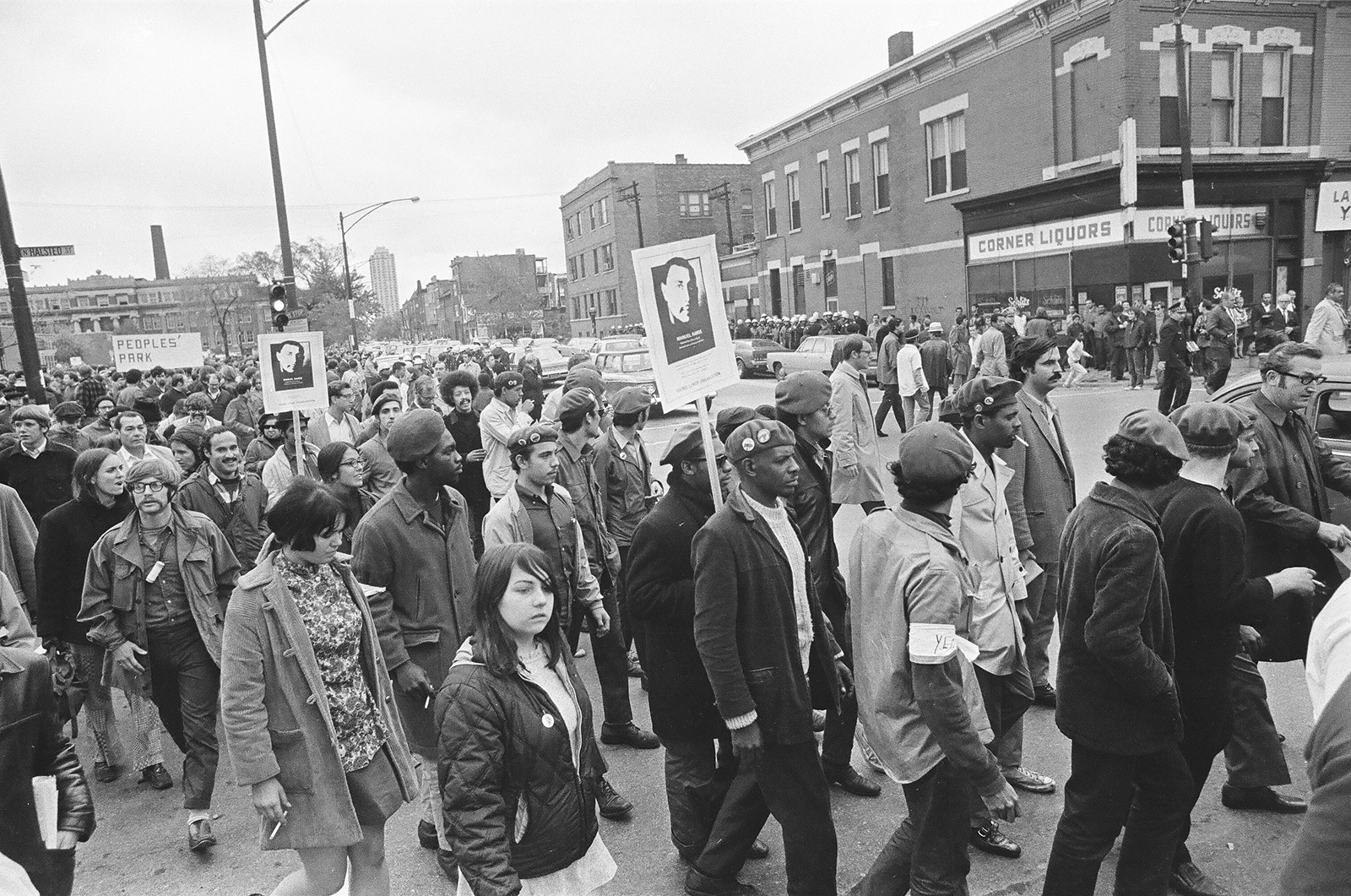 Black and White photograph of a group of people marching